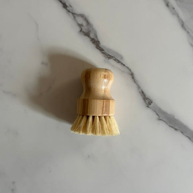 Small wooden brush on a marble surface