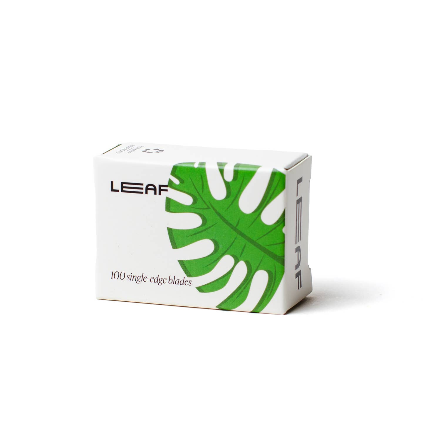 Box of LEAF single-edge blades with a green leaf design on a white background