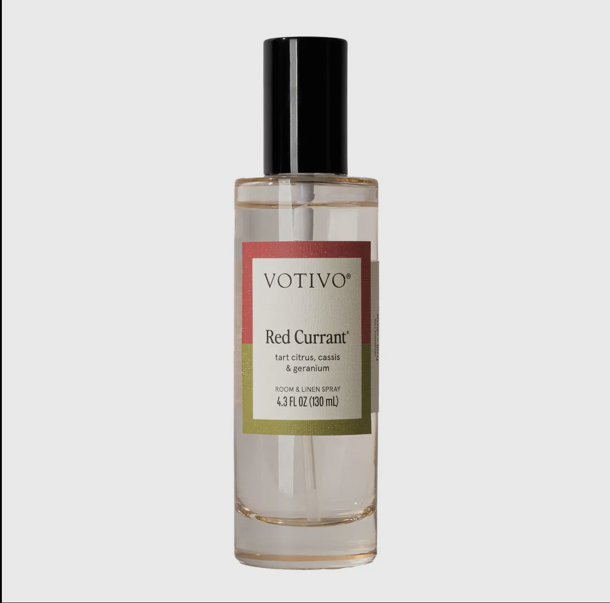 Votivo Red Currant perfume bottle on a light gray background