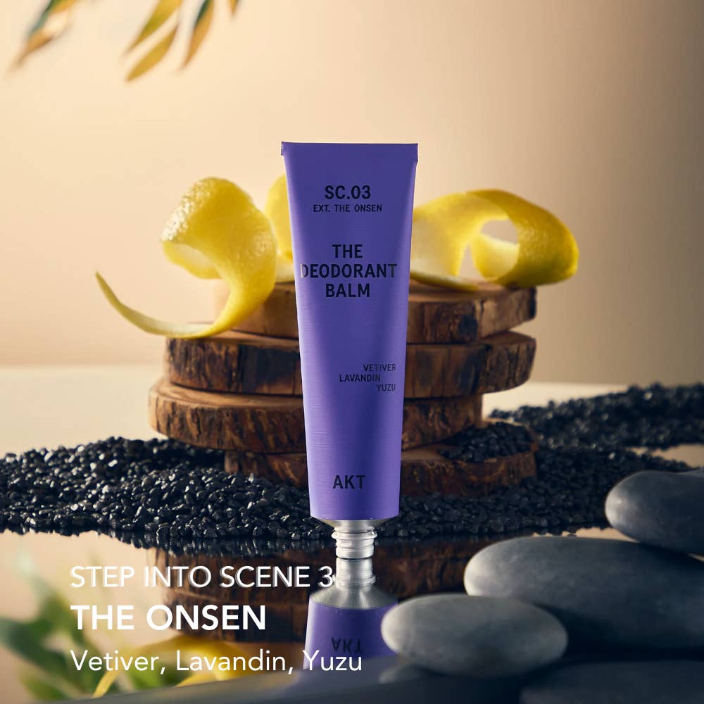 Purple deodorant balm with 'The Onsen' label on a natural setting with lemons and stones. Plastic Free Zero waste