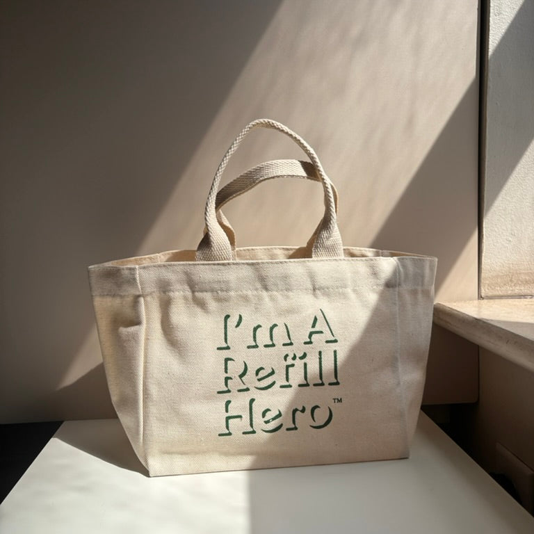 Mini 100 cotton canvas tote with "I'm a Refill Hero" print on it.