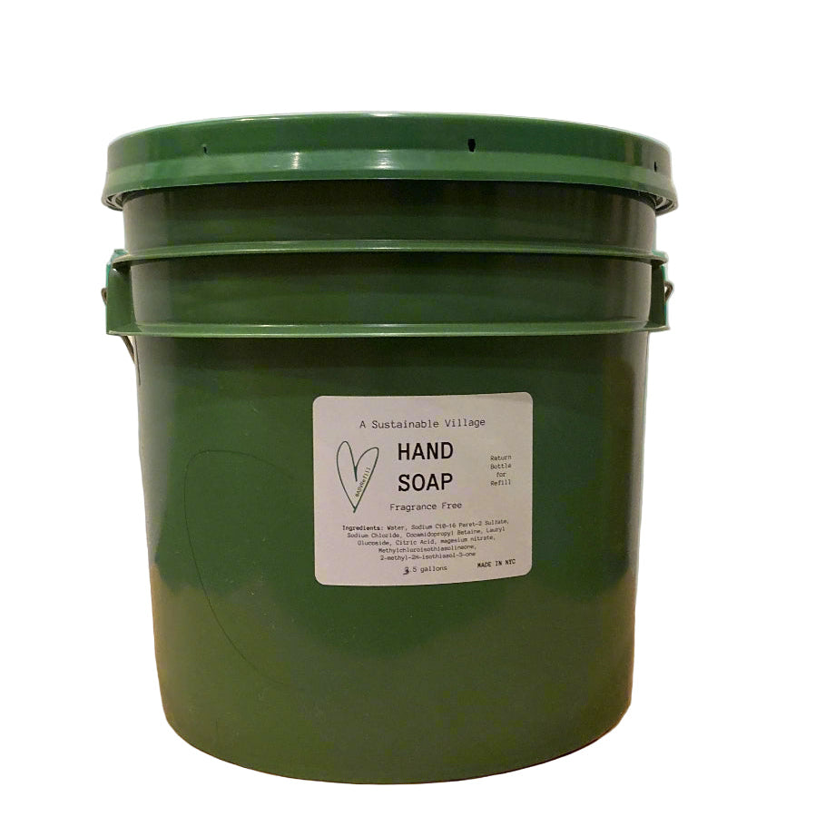 Green bucket of hand soap with a label on a white background