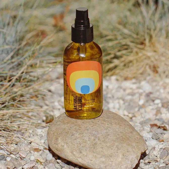 Bottle of natural oil on a rock with a natural background