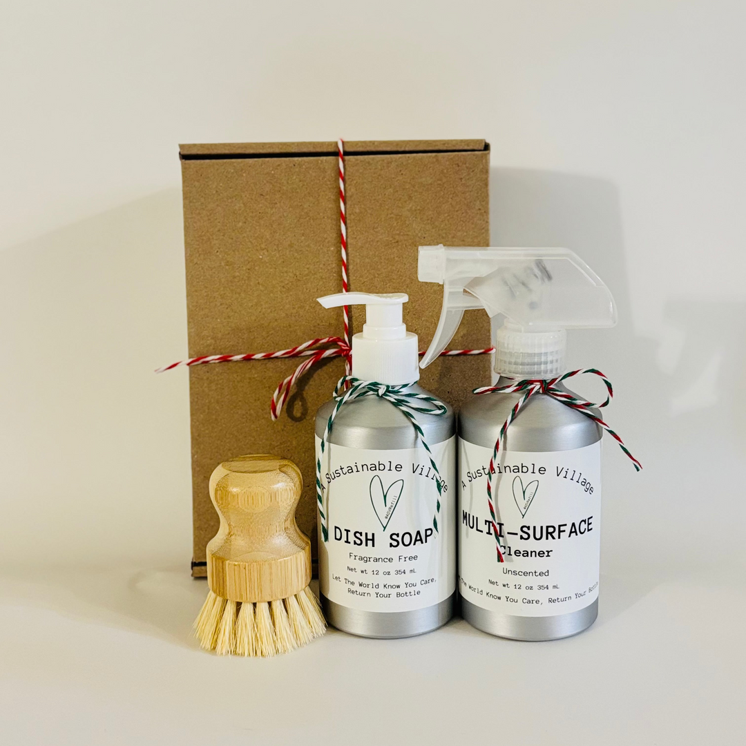 Set of cleaning products including a dish soap bottle, multi-surface cleaner, and a wooden brush, tied with red and white string, on a beige background.