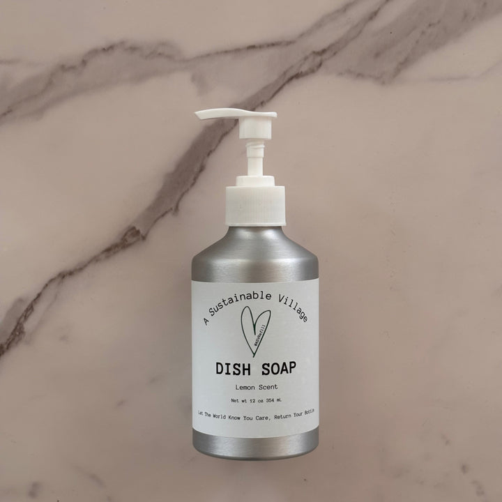 Lemon Dish soap in aluminum bottle with white pump on a marble surface