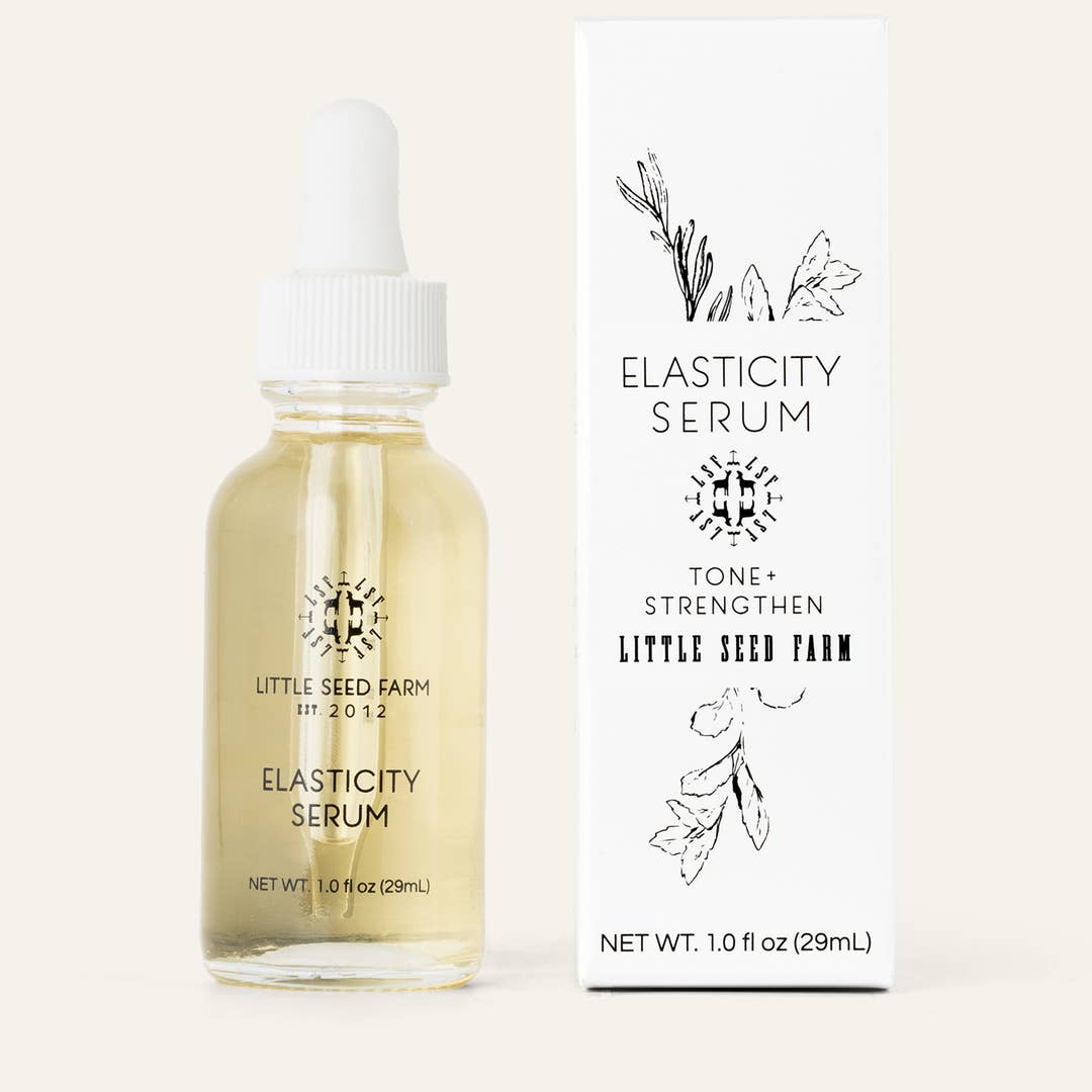 Elasticity serum bottle with dropper and packaging on a white background