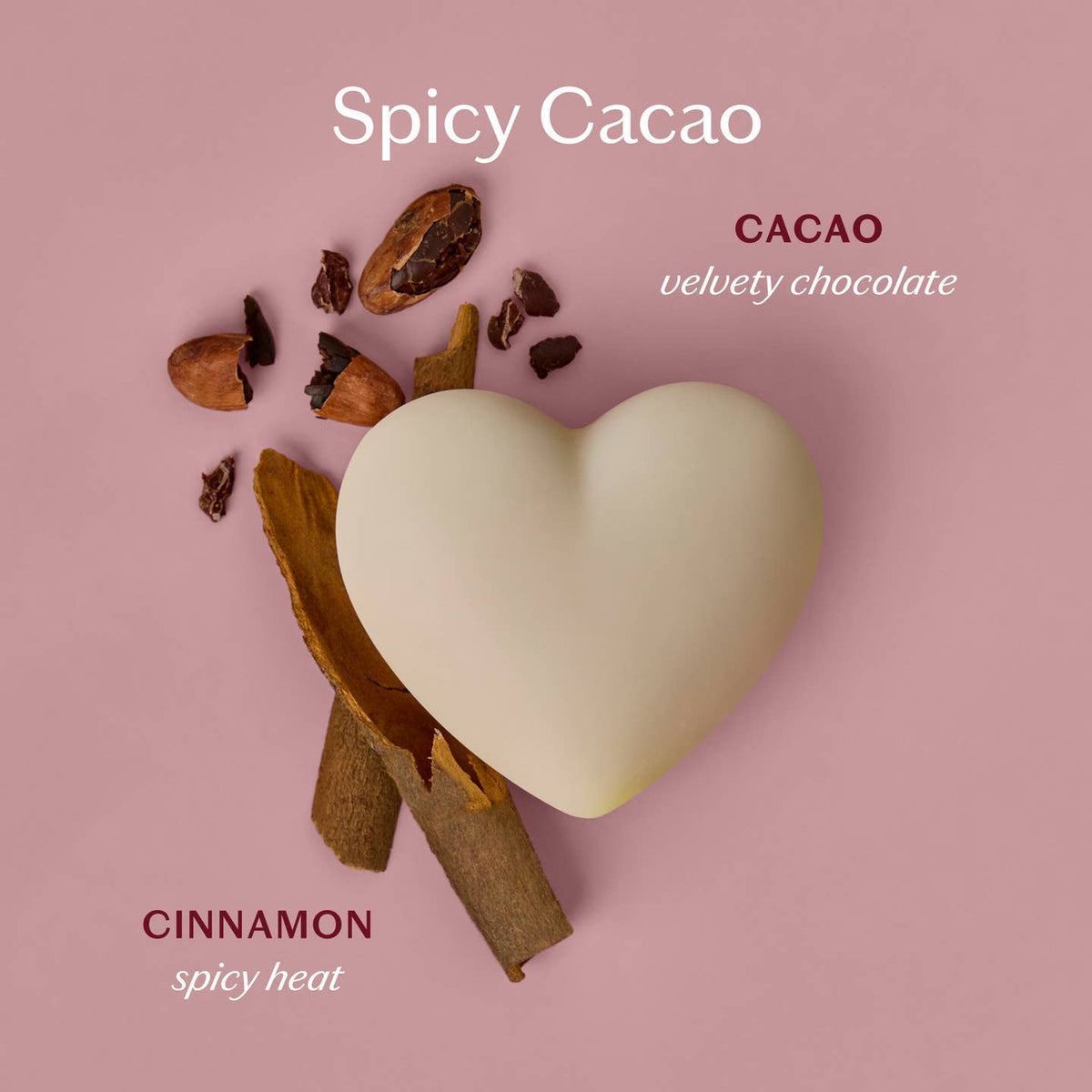 Heart-shaped cacao bar with cinnamon sticks on a pink background, labeled 'Spicy Cacao'.
