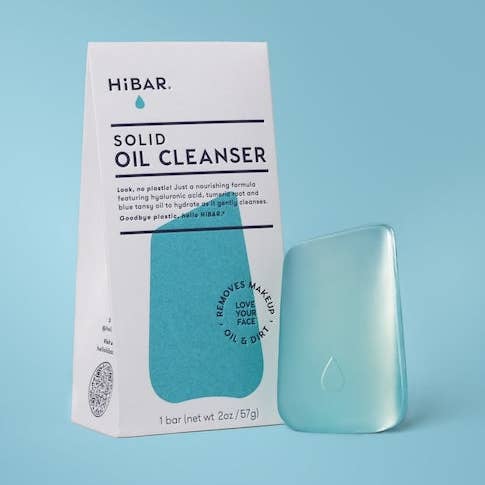 HIBAR solid oil cleanser bar and packaging on a blue background