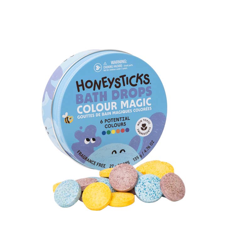 Honeysticks Bath Drops Colour Magic packaging with colorful bath bombs on a white background