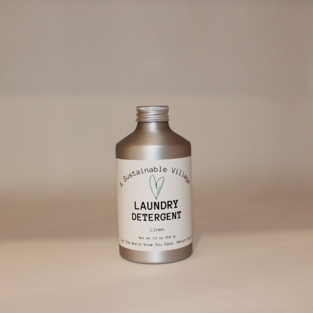 A silver aluminum bottle labeled 'LAUNDRY DETERGENT' by A Sustainable Venture, indicating a capacity of 1 liter.