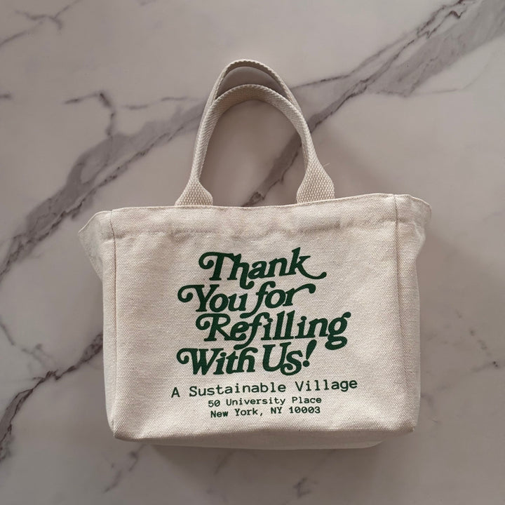 Canvas bag with text on a marble surface
