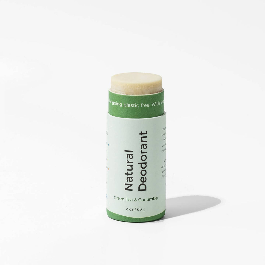 Natural deodorant stick with green label on a white background Green Tea & Cucumber
