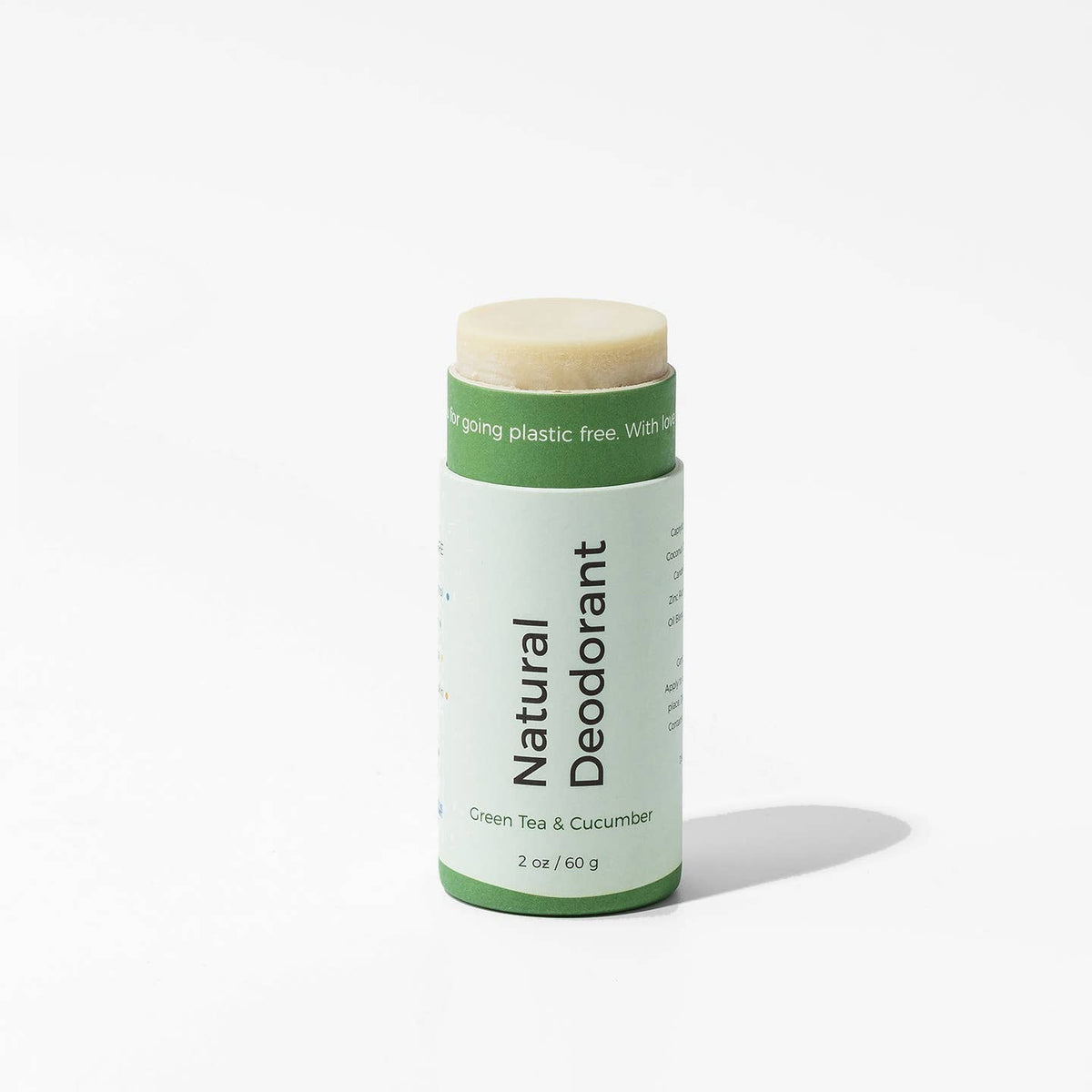 Natural deodorant stick with green label on a white background Green Tea & Cucumber