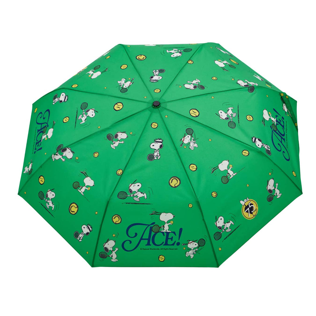 Green umbrella with cartoon character pattern on a white background