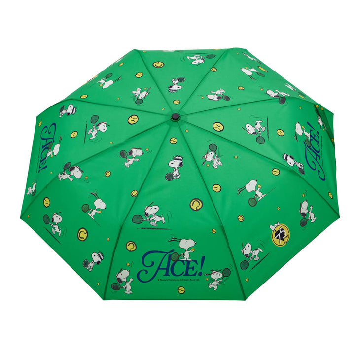 Green umbrella with cartoon character pattern on a white background
