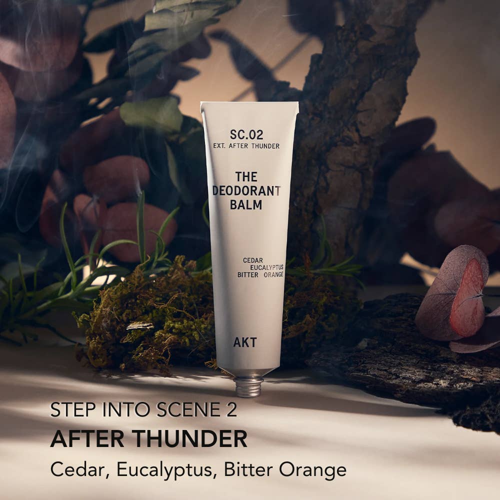 Deodorant balm tube labeled 'SC.02 THE DEODORANT BALM' with natural elements in the background.  Plastic free Zero Waste