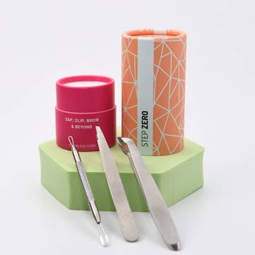 Stainless Steel tweezer, blackhead remover, and cuticle cutter inside a cylinder paper tube.