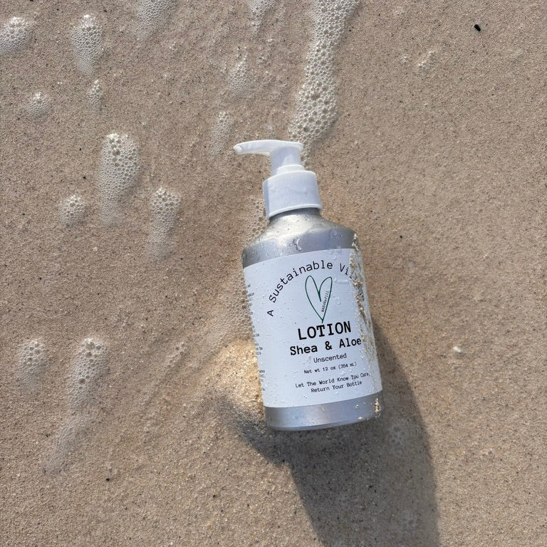 Fragrance Free Lotion in Aluminum Bottle washed up on beach