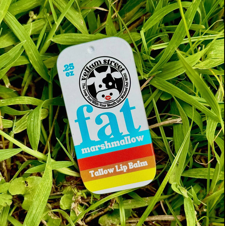 Fat Marshmallow tallow lip balm packaging on grass